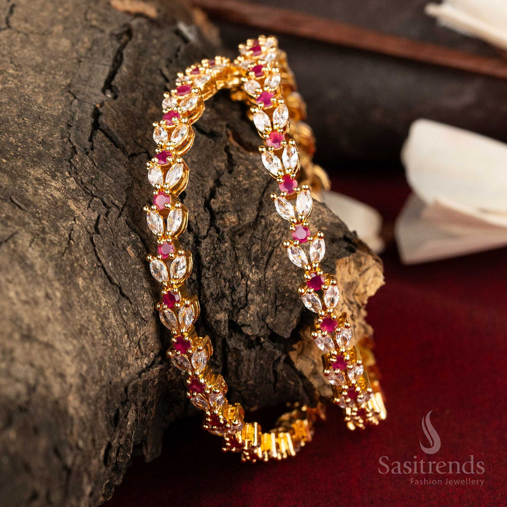 Captivating micro gold plated American diamond bangles showcasing a stunning floral leaf pattern with a unique white and ruby fusion, adding a luxurious touch to exquisite jewellery collections - Sasitrends