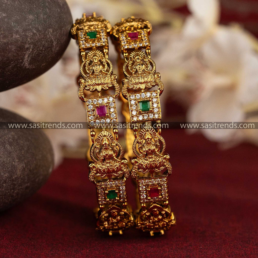 Elegant temple jewellery bangles with detailed Lakshmi motifs and AD stone studded frames, ideal for weddings and festive celebrations.