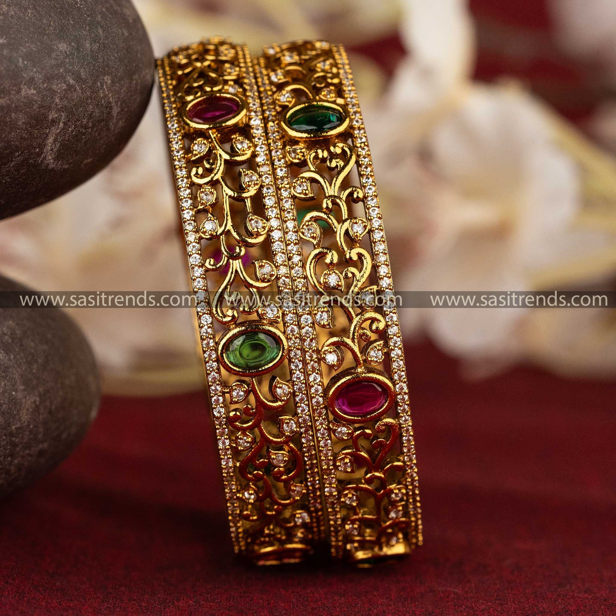 Intricate floral and vine motif matte gold bangles with AD stones Sasitrends