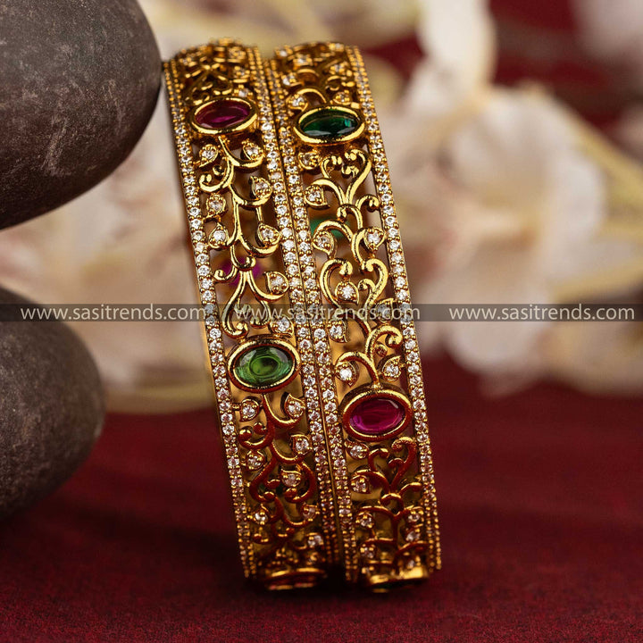 Sasitrends | Intricate Floral and Vine Motif Matte Gold-Plated Temple Bangles with Multi AD Stones