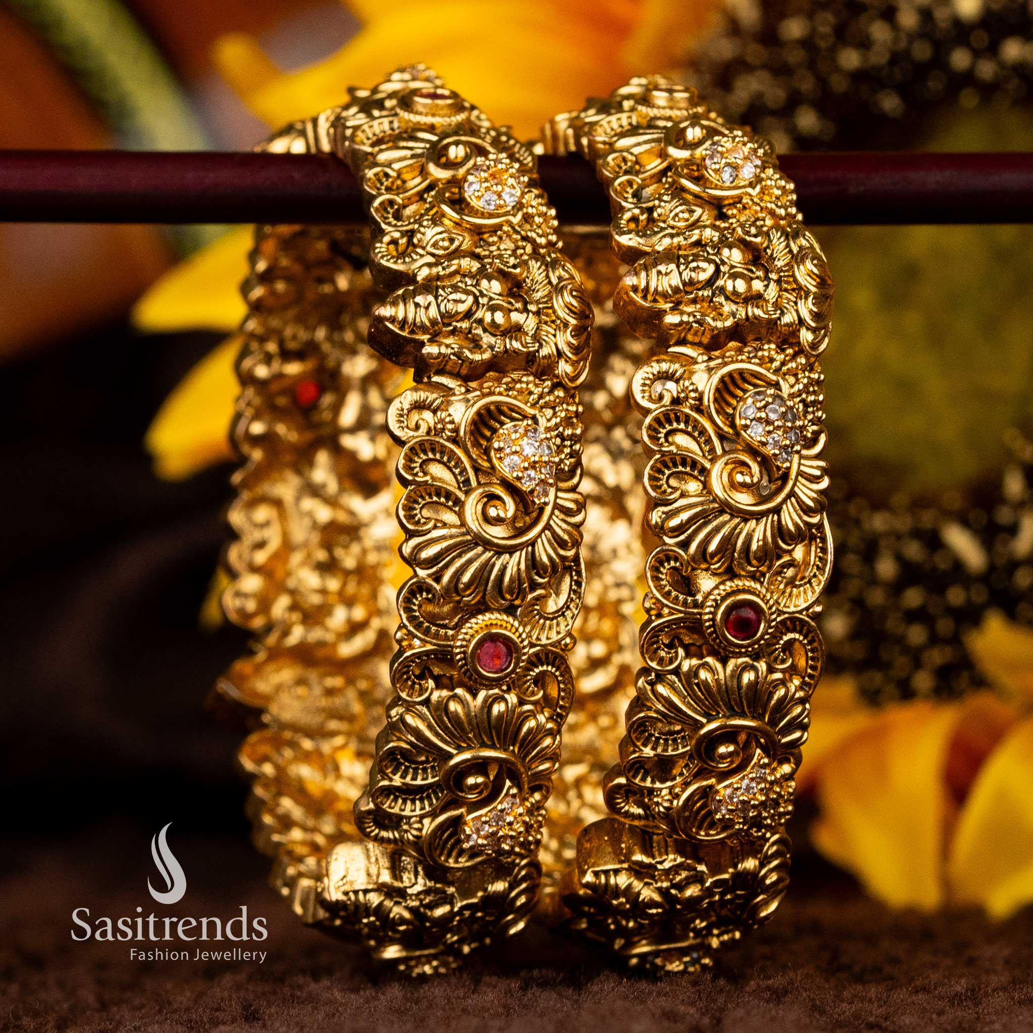 Temple bangles with Lakshmi motifs and American diamonds for weddings - Sasitrends