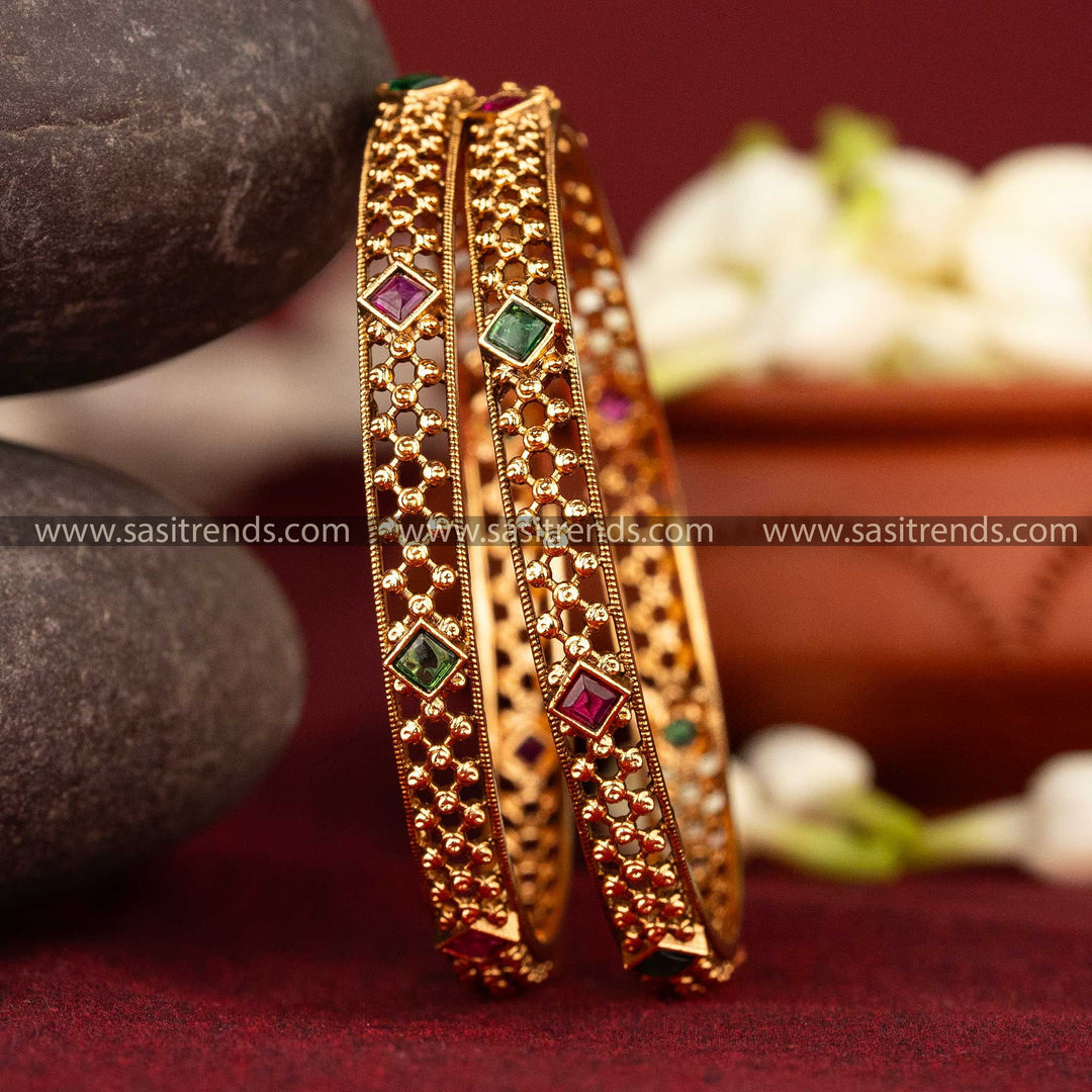 Ruby-green antique matte gold bangles with detailed beadwork and Kemp stones