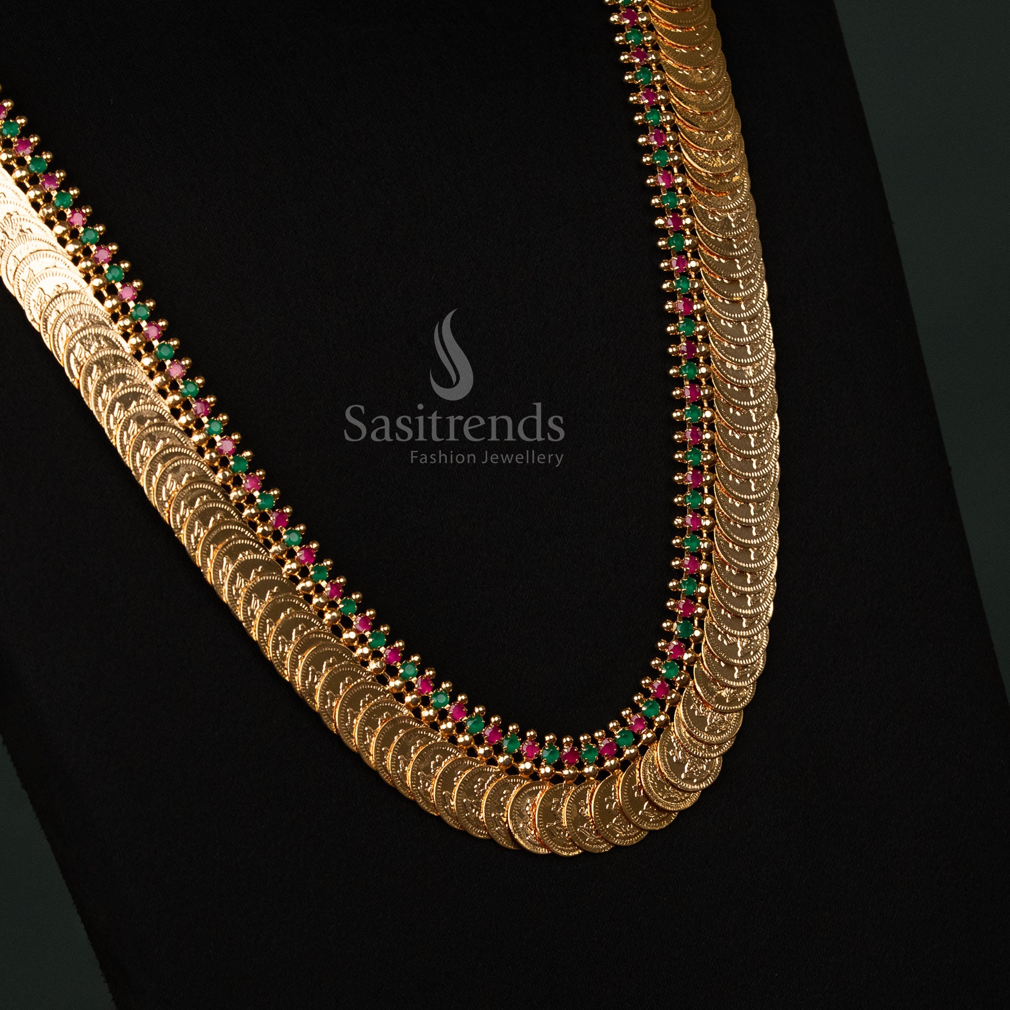 Grand micro gold-plated Lakshmi coin long necklace, encrusted with dazzling ruby-green American diamonds, perfect for enhancing saree looks during festive occasions - Sasitrends