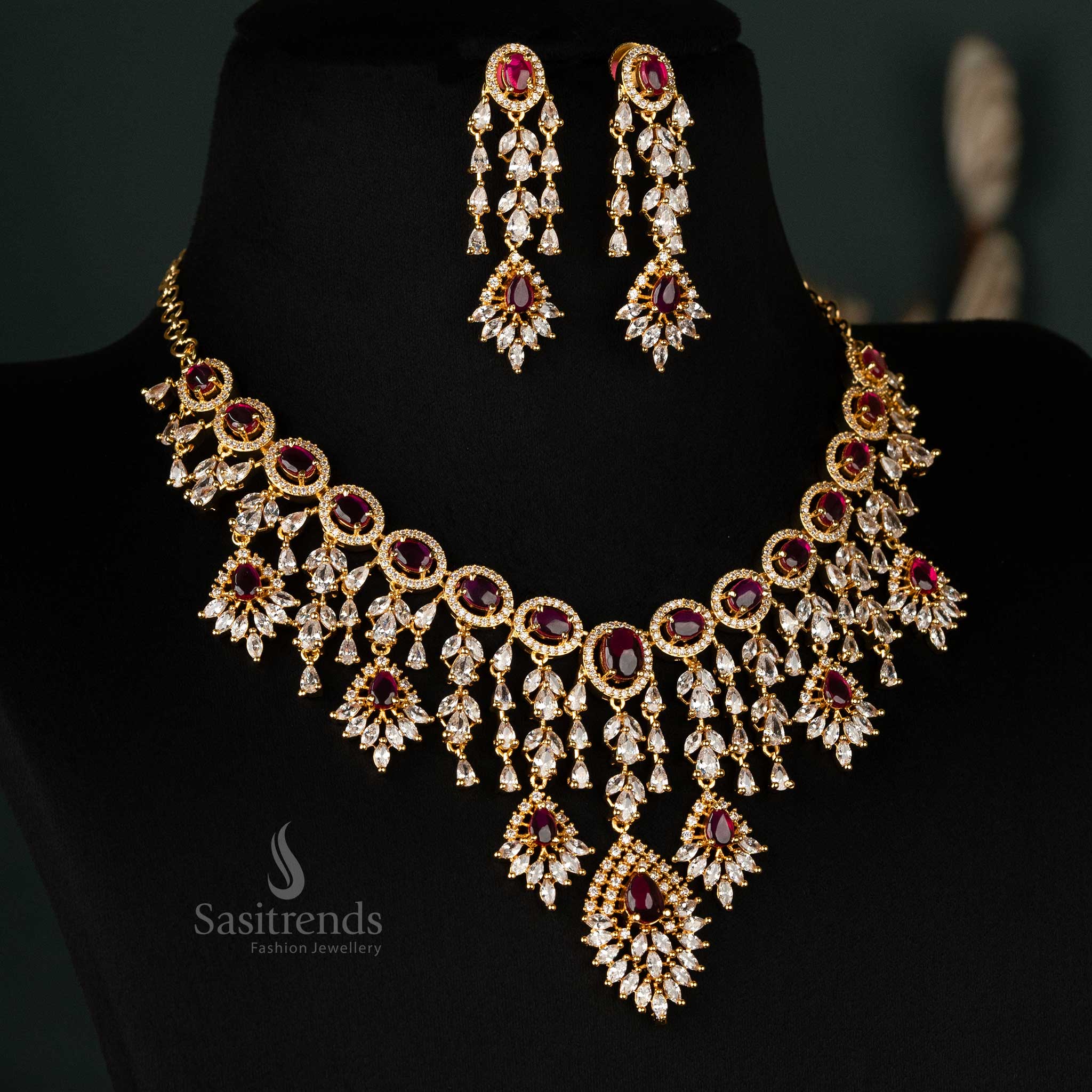 Stunning ruby-colored gold-plated necklace set adorned with American diamonds, ideal for bridal wear and festive celebrations - Sasitrends