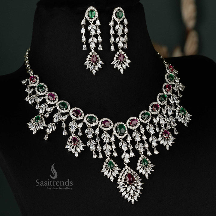 Gorgeous necklace jewellery set designed with rhodium plating, ruby and green accents, and sparkling American diamonds, perfect for parties and bridal attire - Sasitrends