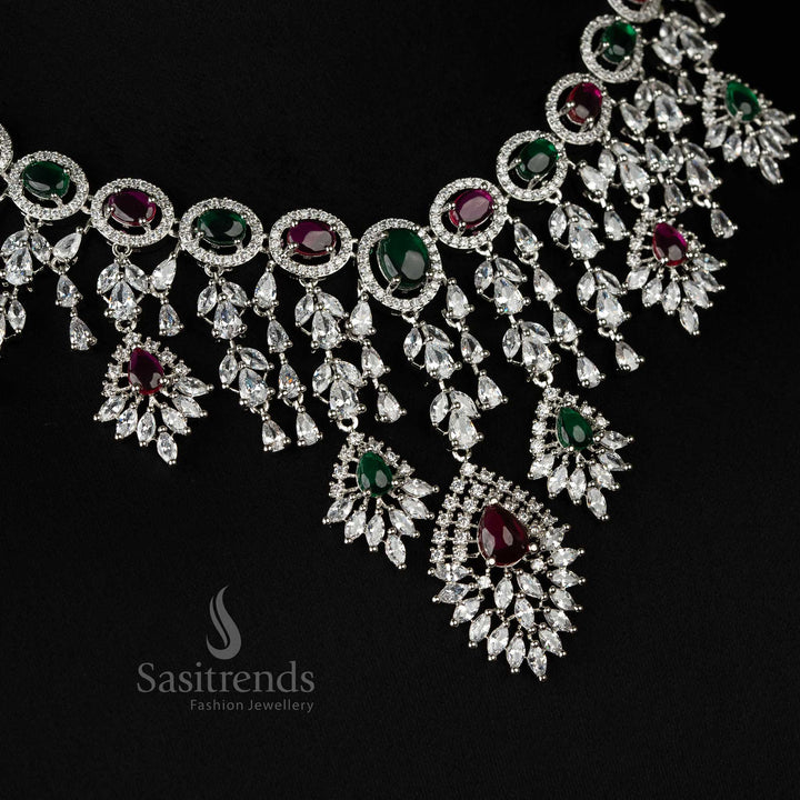 Exquisite rhodium-plated necklace jewellery set with American diamonds, blending ruby and green tones for a glamorous wedding look - Sasitrends