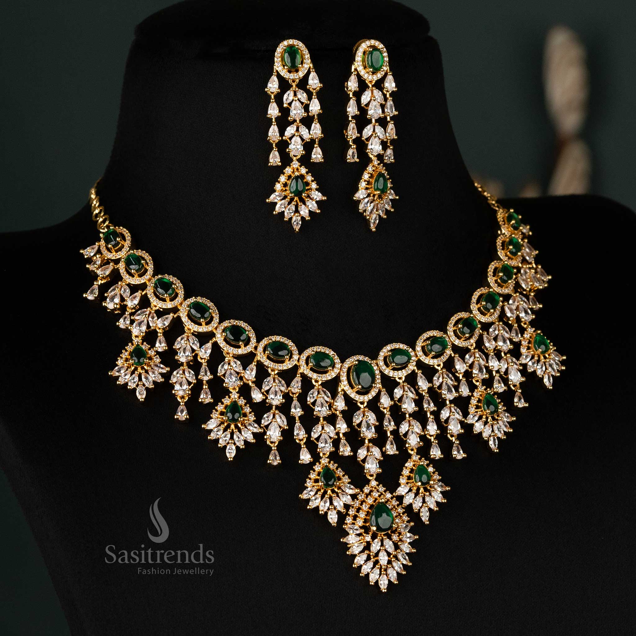 Gorgeous green gold-plated necklace set featuring sparkling American diamonds, perfect for ceremonial occasions and party wear - Sasitrends