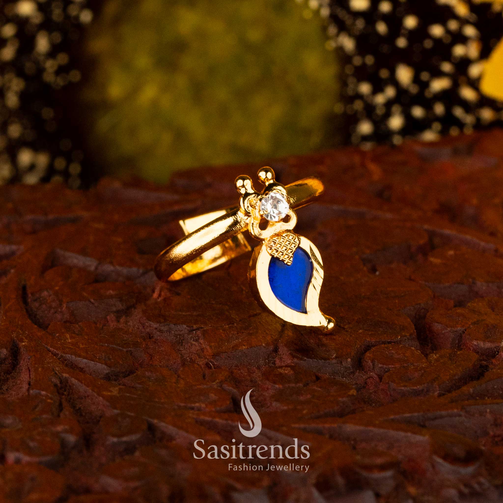 Adjustable blue palakka ring by Sasitrends with gold plating