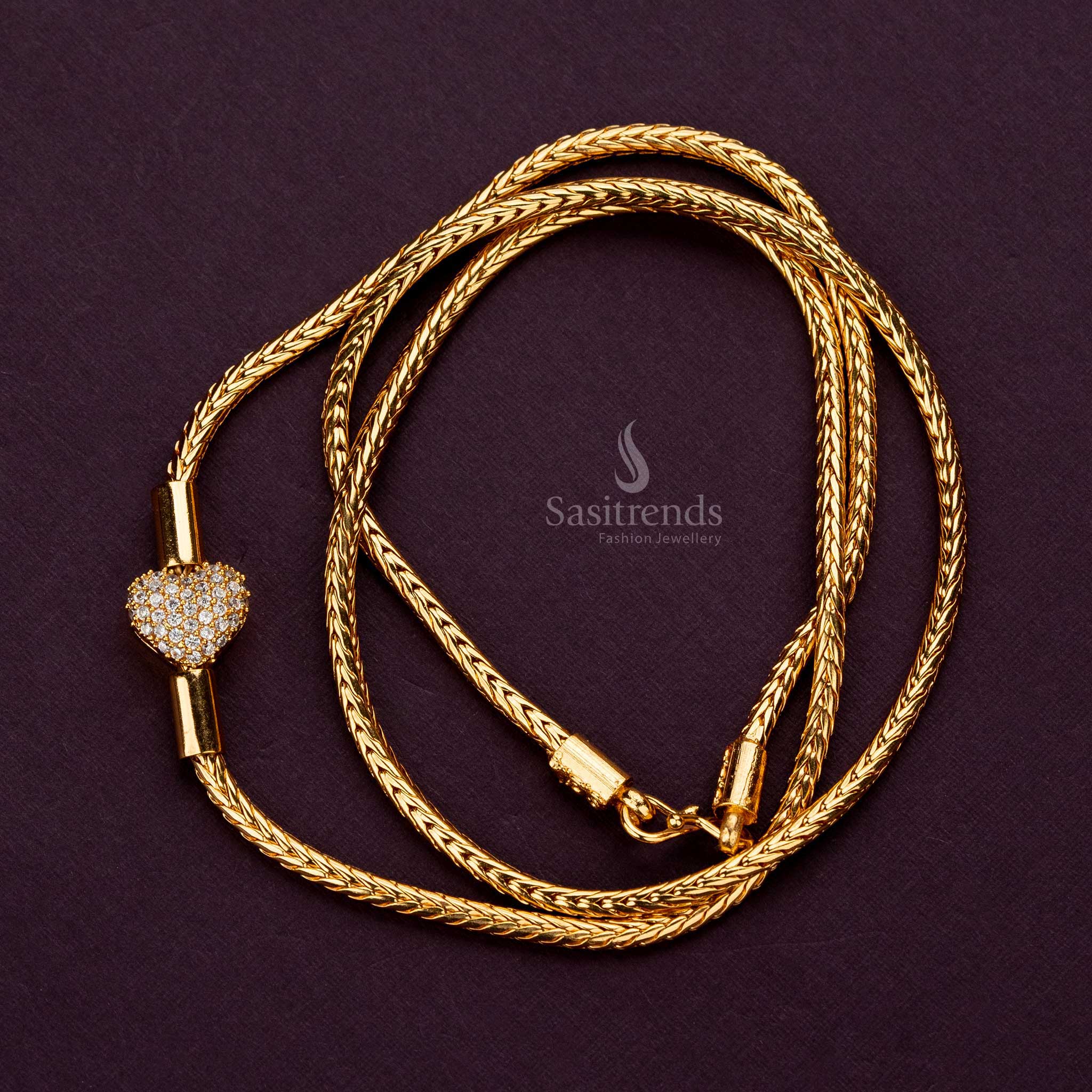 Elegant mugappu chain with White AD stone showcasing intricate heart design and luxury - Sasitrends