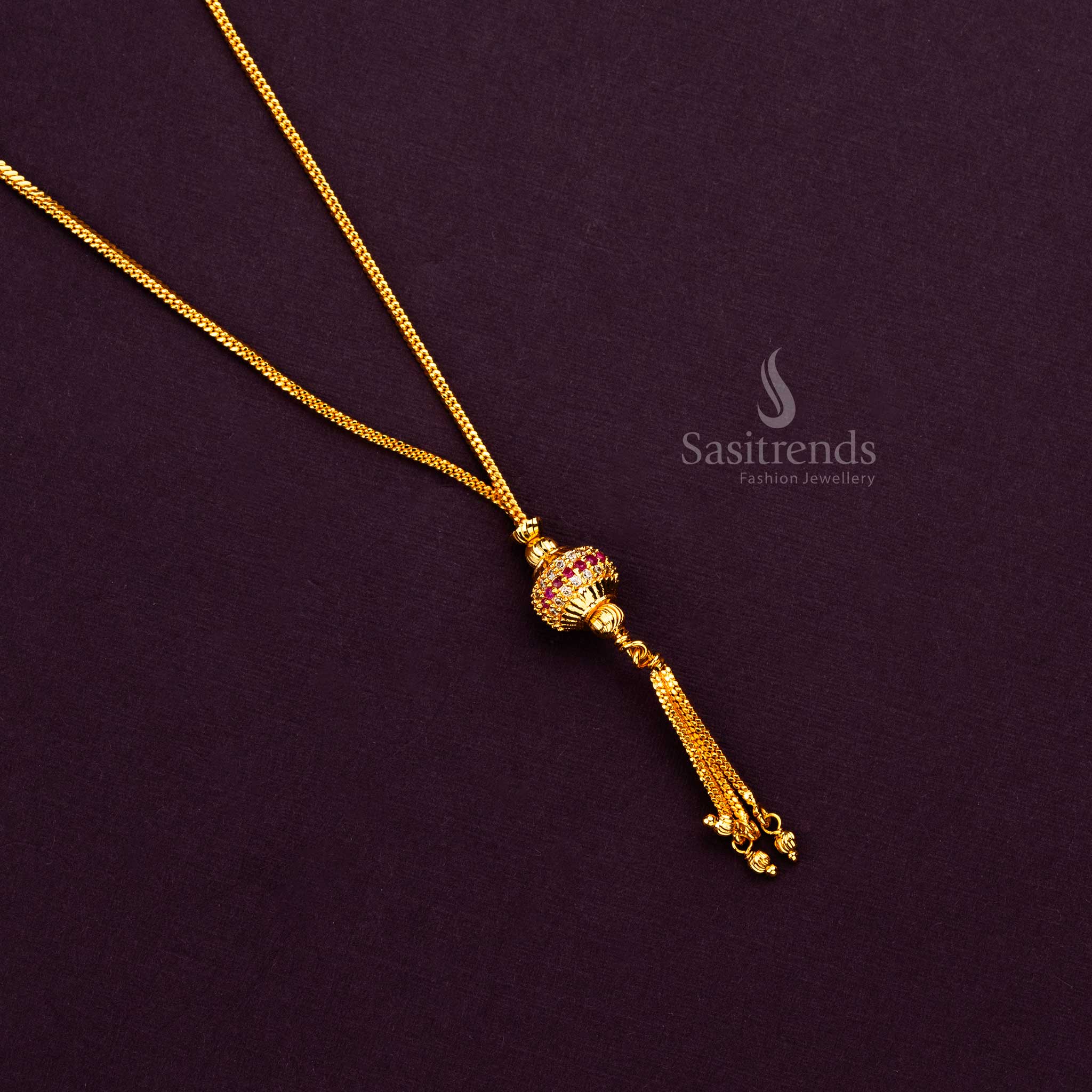 Traditional micro gold plated necklace with vibrant stone-adorned bead pendant and gold tassels, ideal for ethnic occasions.