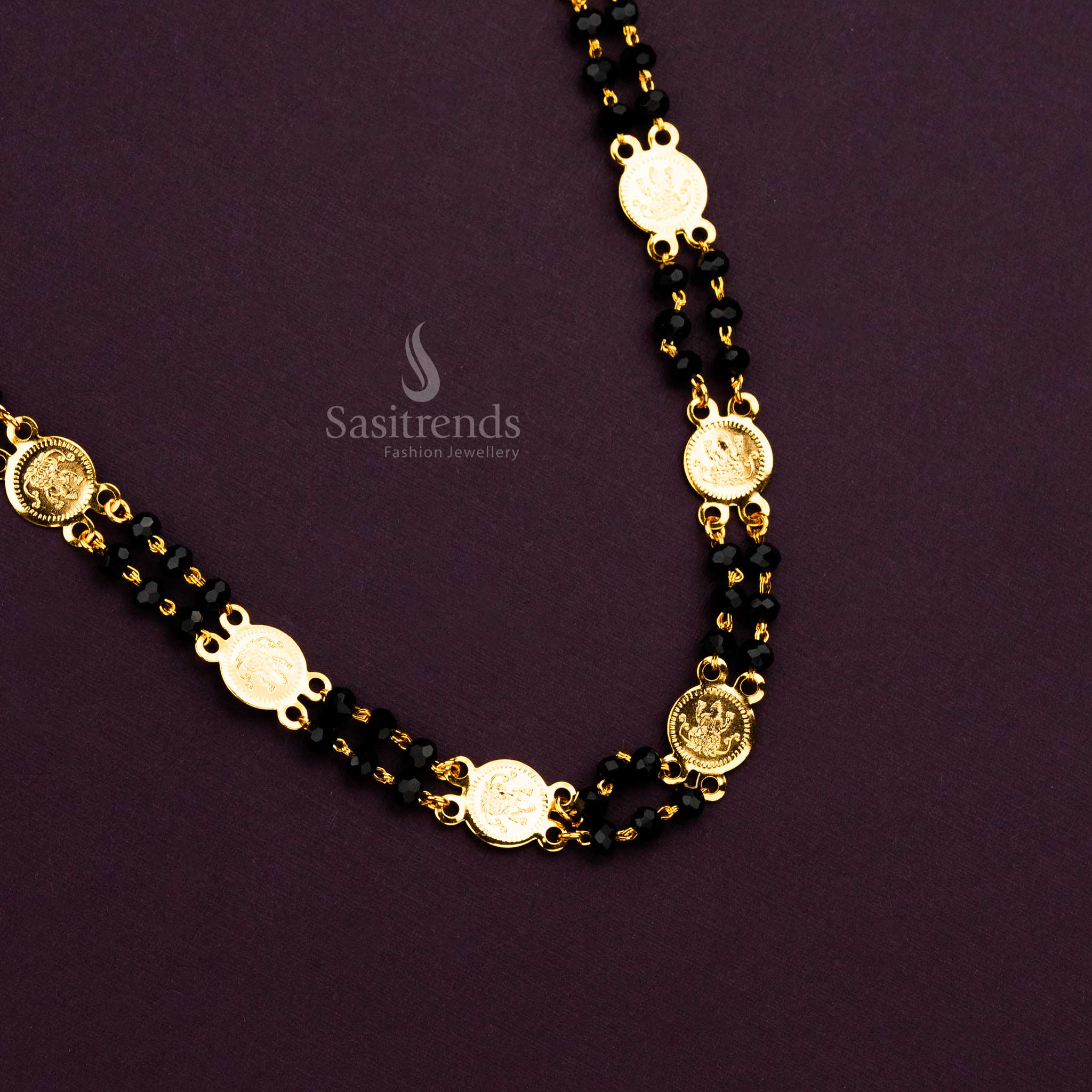 Traditional South Indian temple necklace with embossed Lakshmi coins and black beads.  