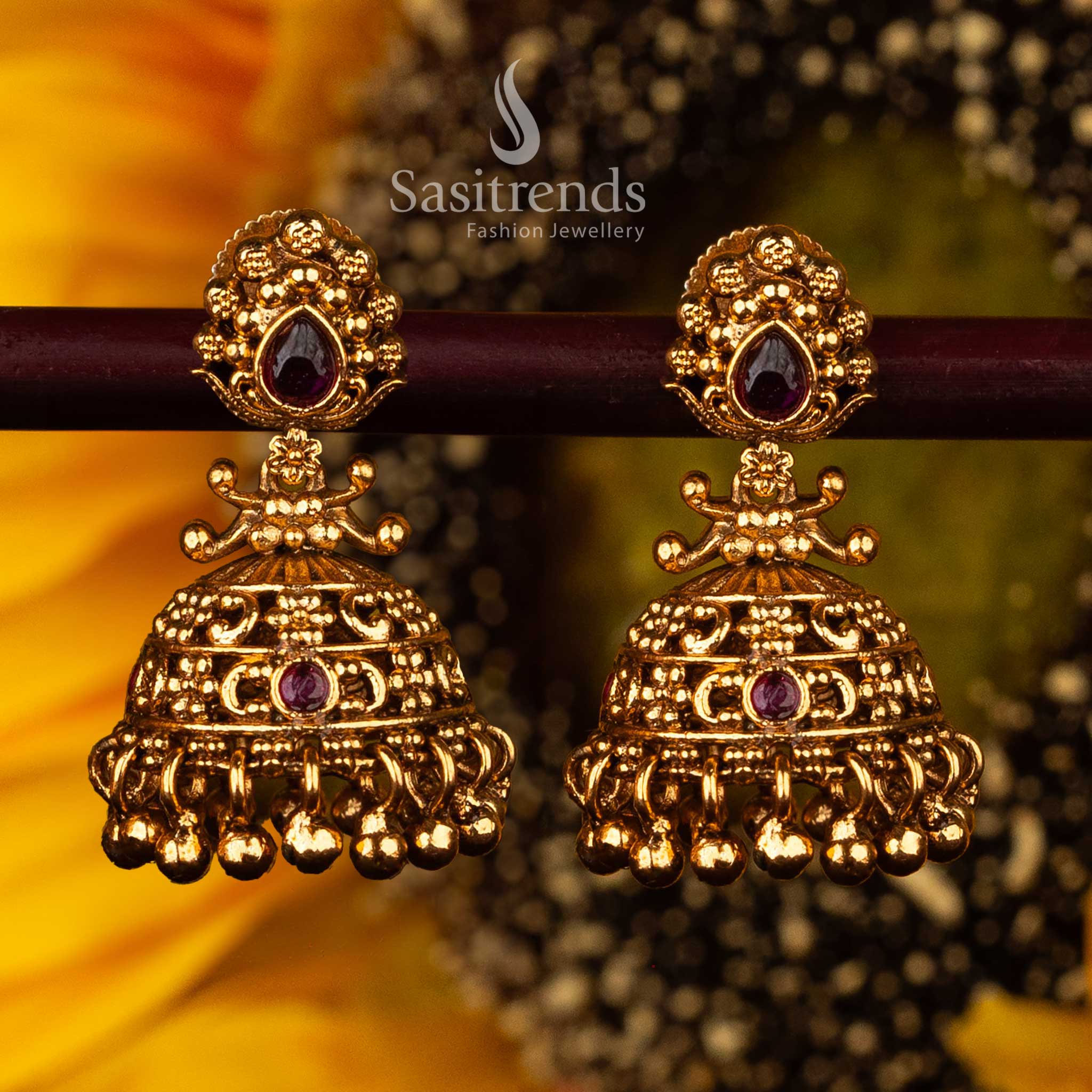 Festive ruby temple jhumka earrings with golden ball hangings - Sasitrends





