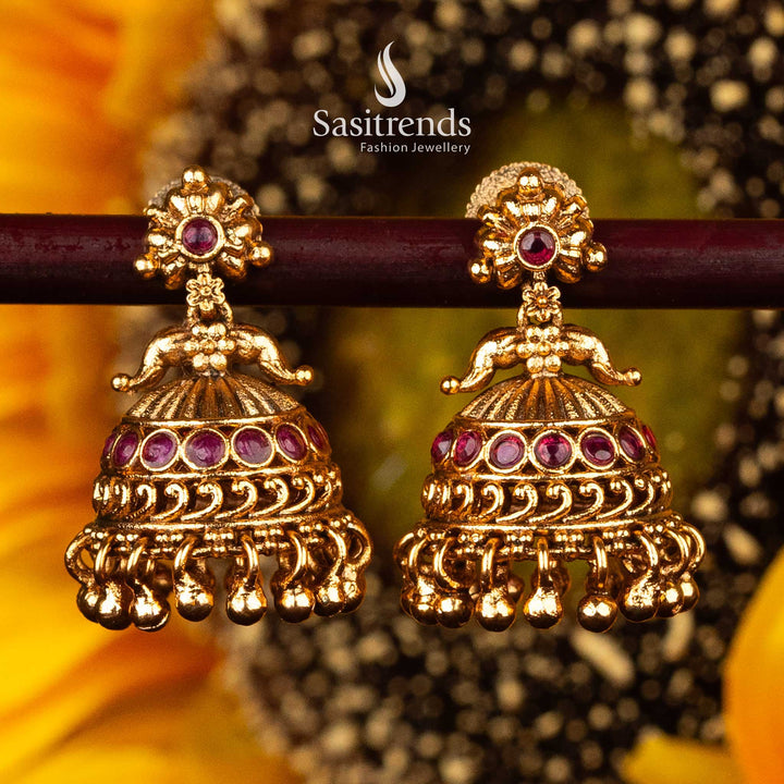 Ruby stone-studded jhumka earrings with floral design - Sasitrends