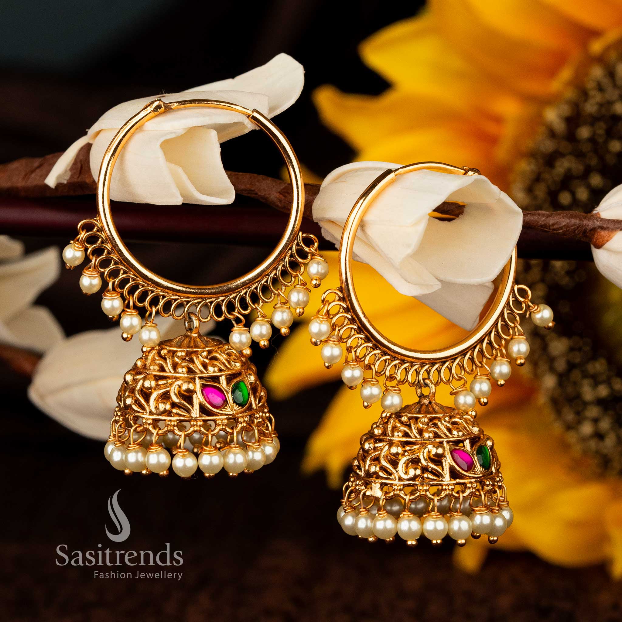 Traditional ruby-green jhumka earrings adorned with pearl ball hangings - Sasitrends