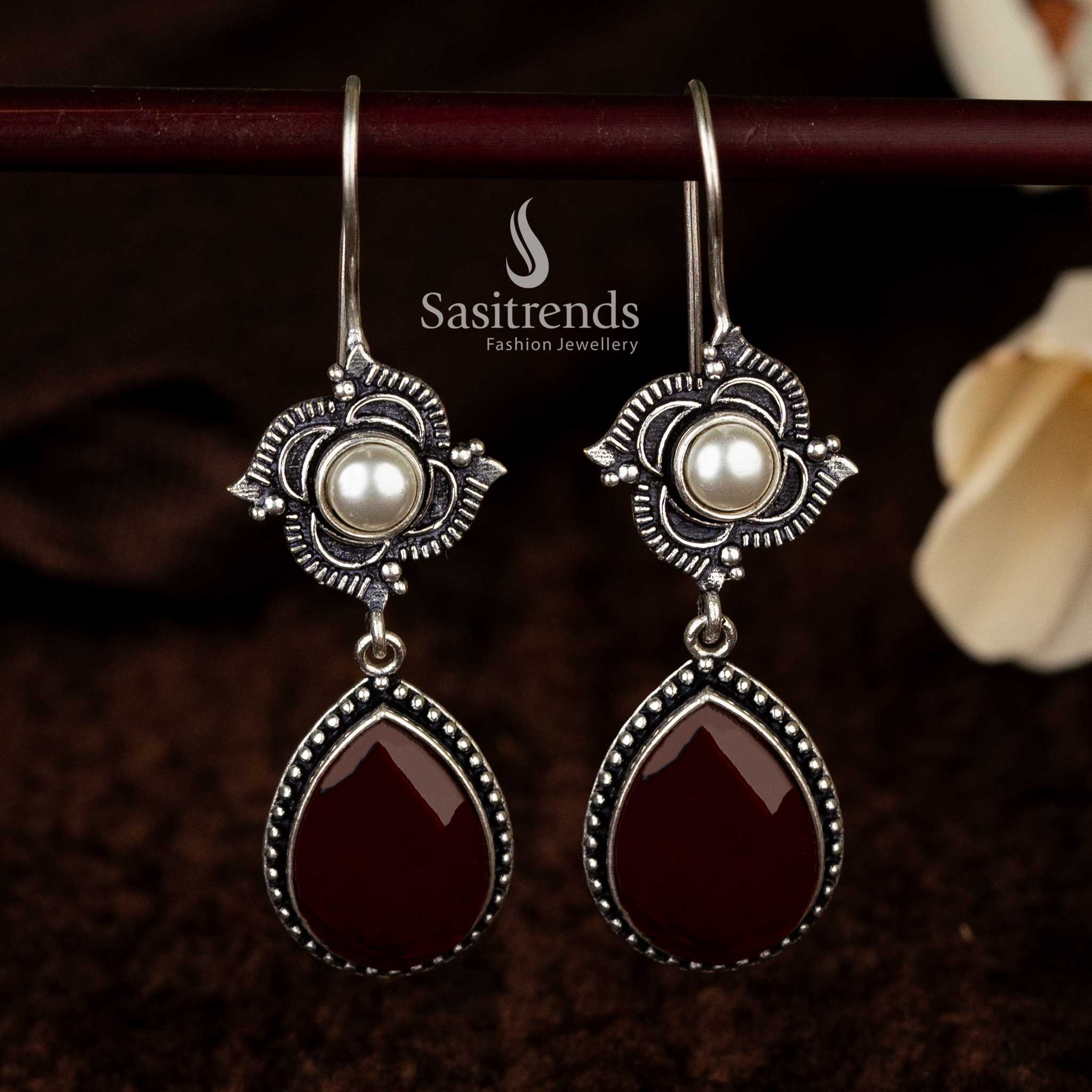 Unique oxidised earrings featuring maroon gemstone and pearl accents - Sasitrends