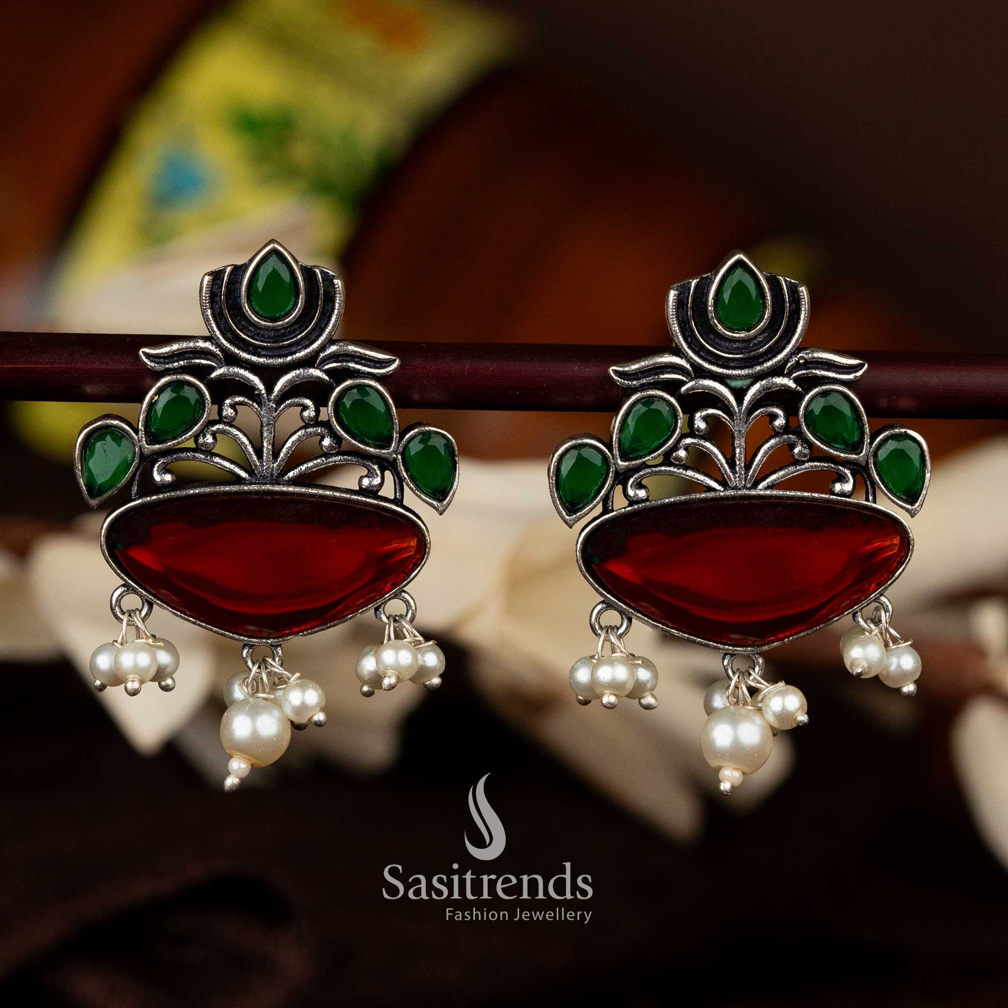 Elegant ruby and green lotus oxidised earrings with half-moon drop and pearl hangings - Sasitrends