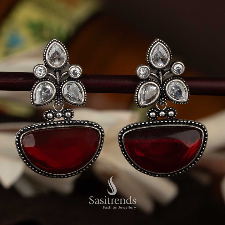 Oxidised silver earrings with maroon half-moon drop and floral details - Sasitrends