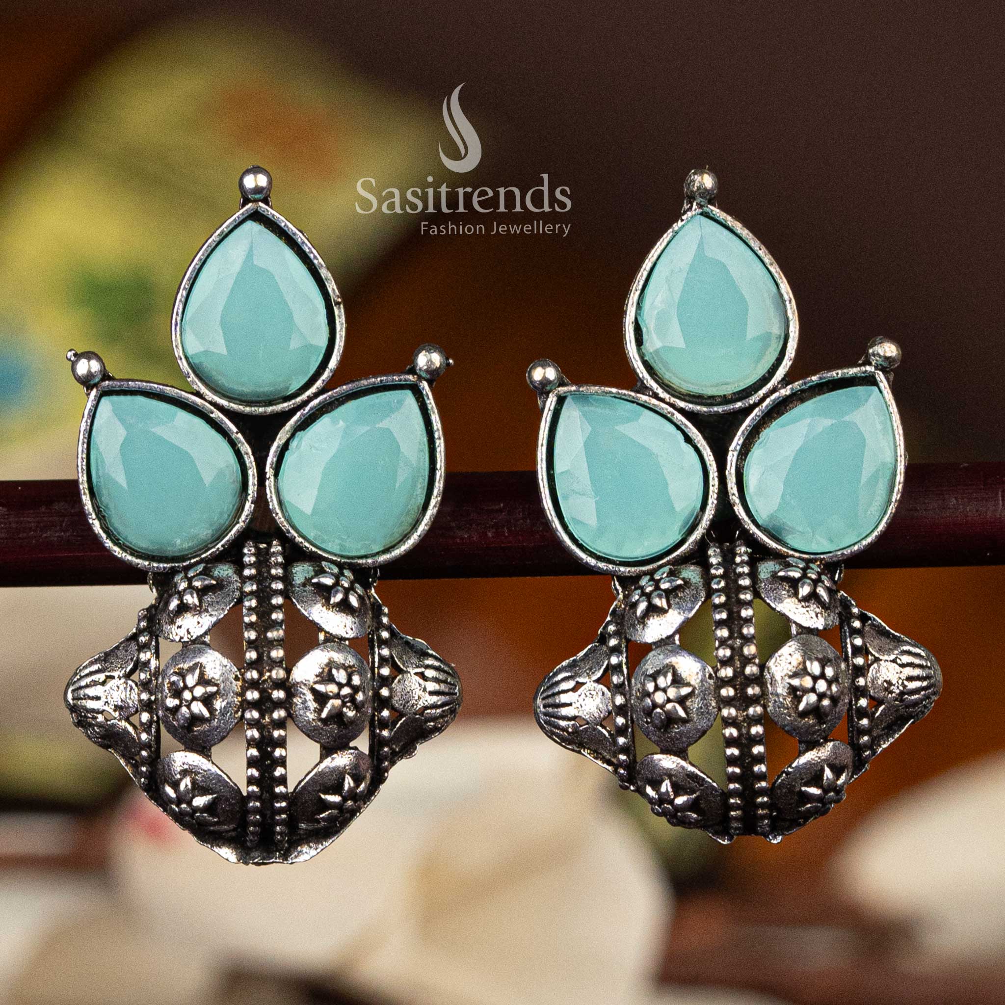 Classic oxidised silver earrings with Mint pear-shaped stones and floral design  - Sasitrends