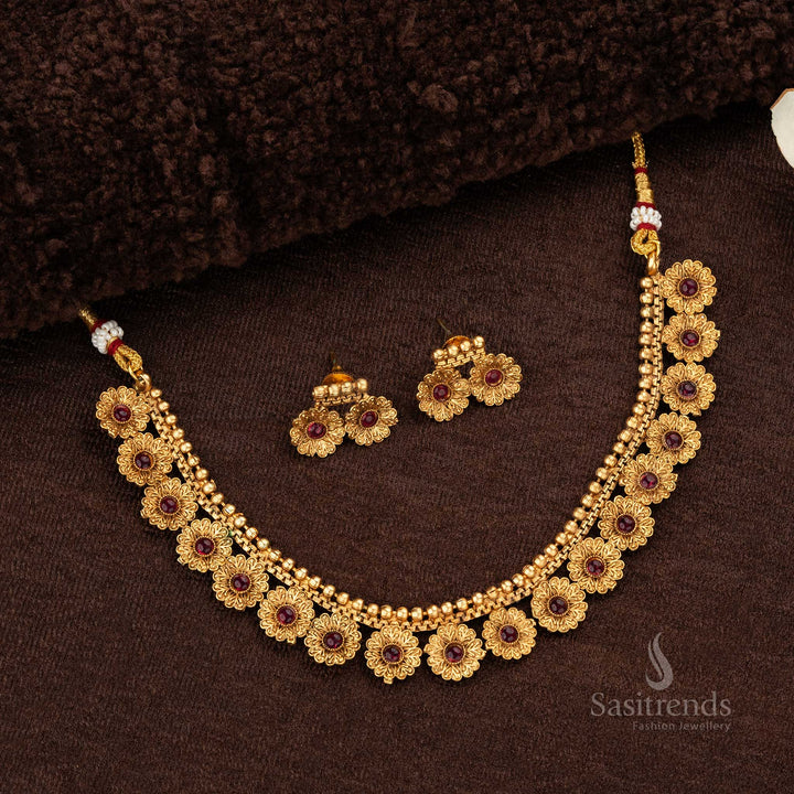 Floral design matte gold-plated temple necklace set featuring ruby stones and matching earrings - Sasitrends