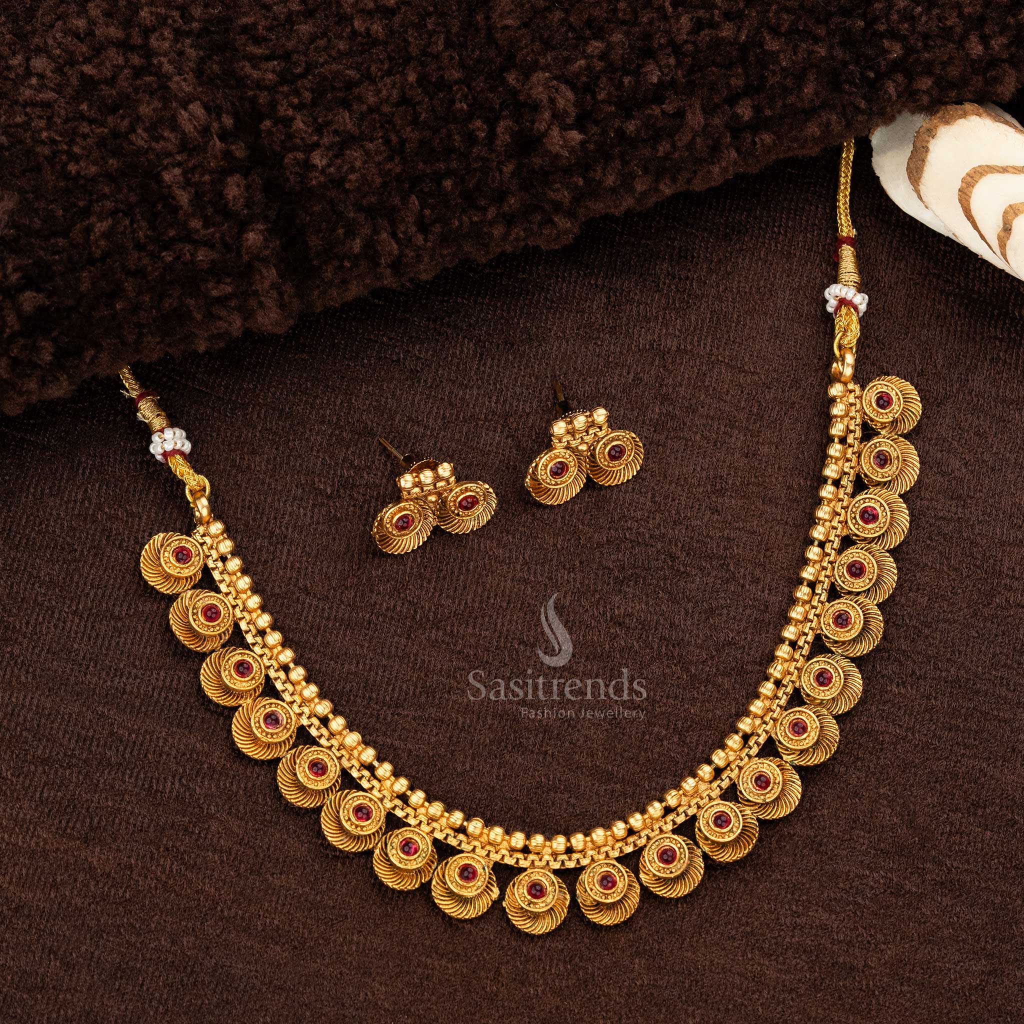 Intricate round design matte gold temple necklace set featuring ruby stones, paired with elegant matching earrings - Sasitrends