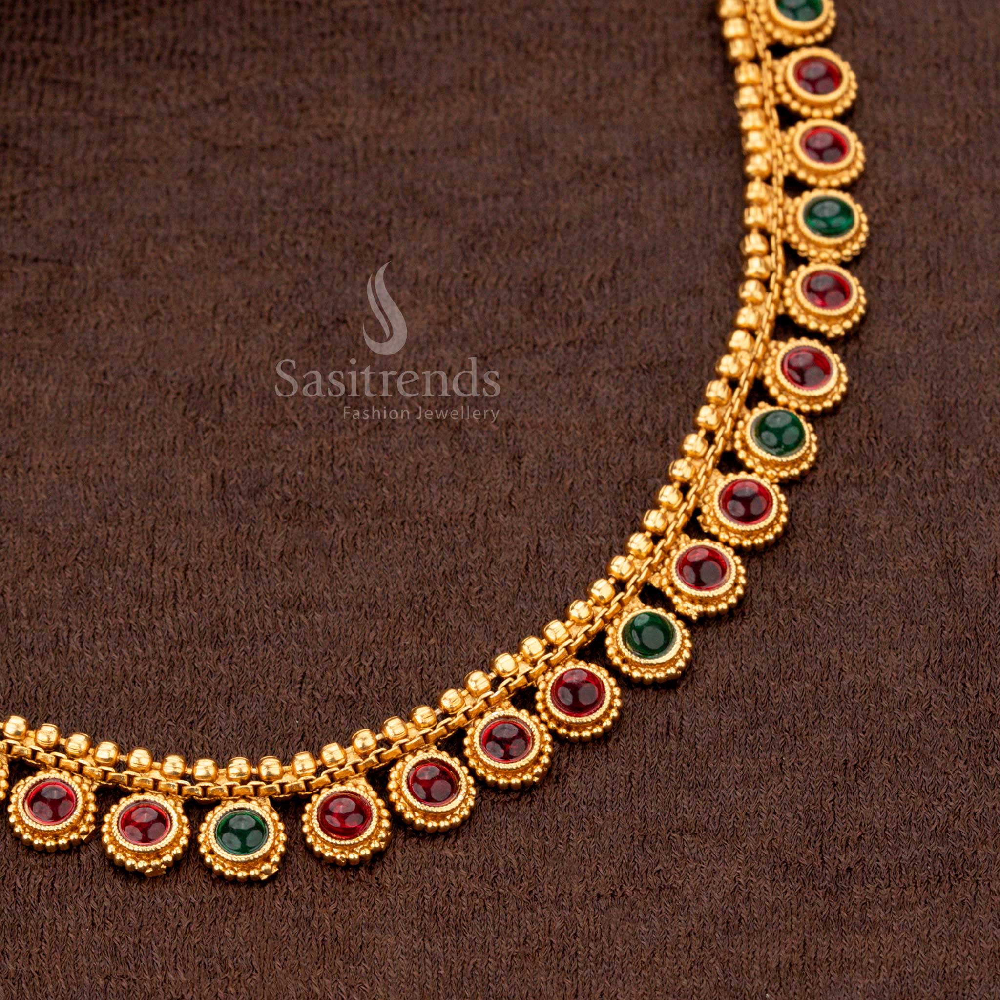 Dual-tone ruby-green circular motif necklace set in matte gold - Sasitrends