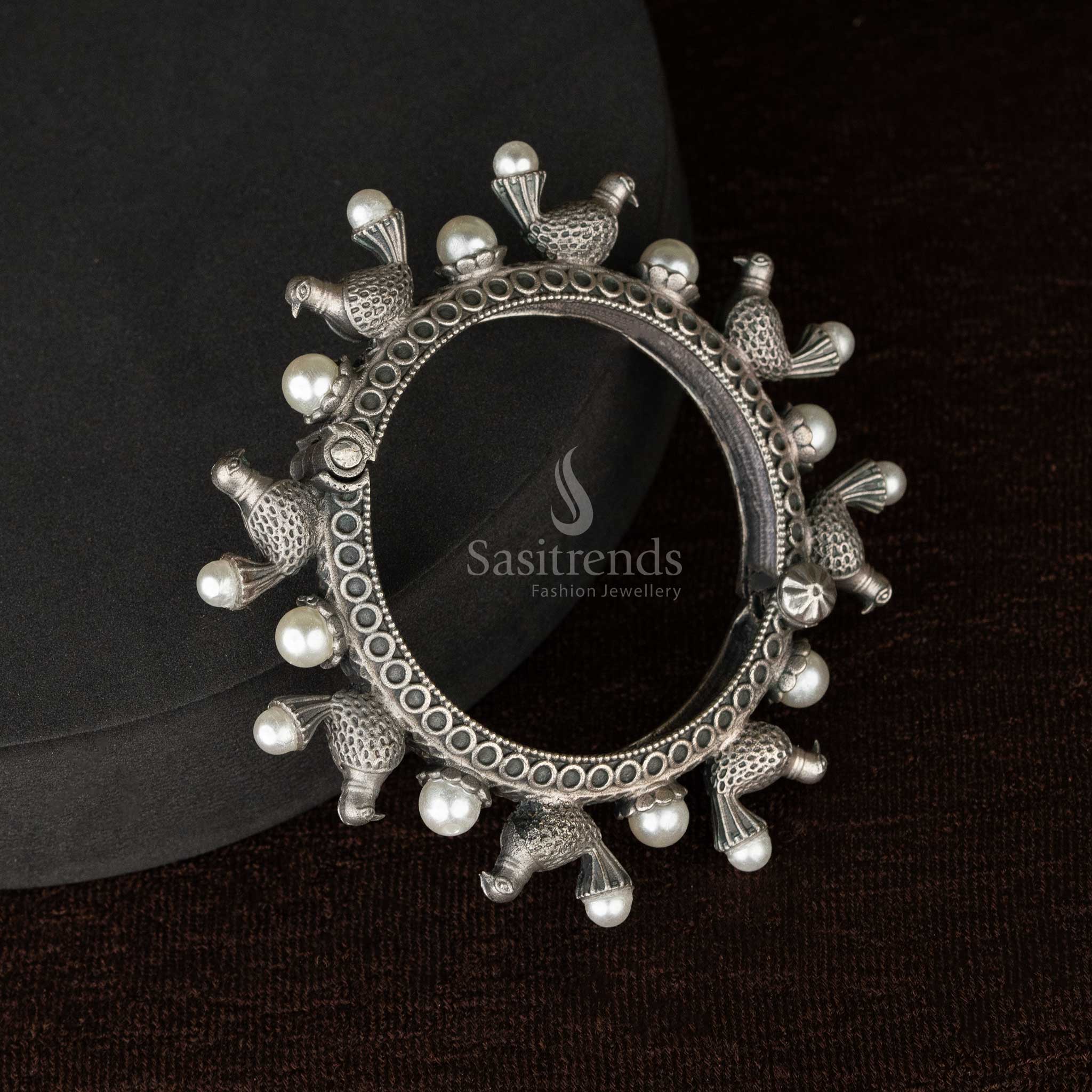 Intricate peacock motif oxidised silver bangle with screw clasp - Sasitrends