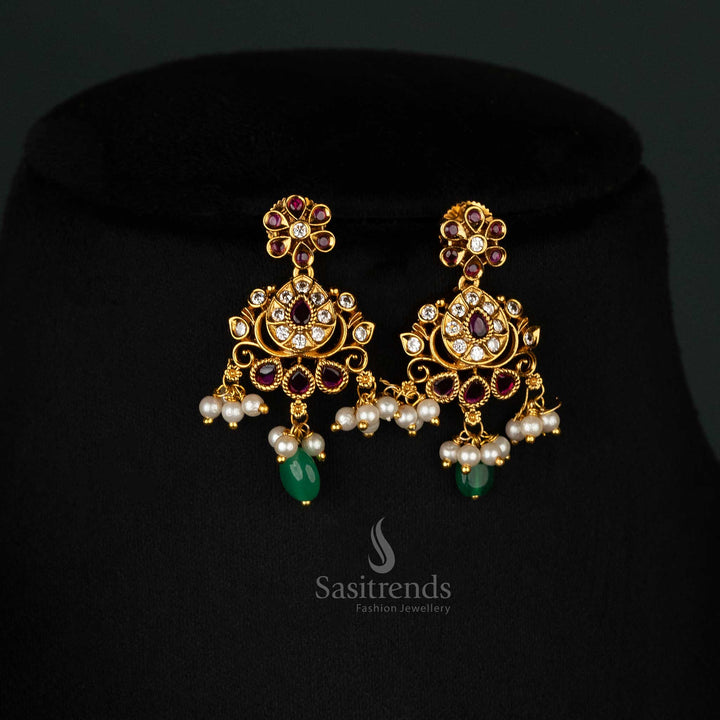 Timeless ruby-adorned matte gold earrings set with intricate floral designs for bridal wear - Sasitrends