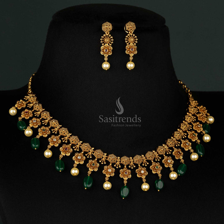 Exquisite temple matte gold-plated jewellery set with floral motifs and green bead drops, designed for bridal and festive occasions - Sasitrends