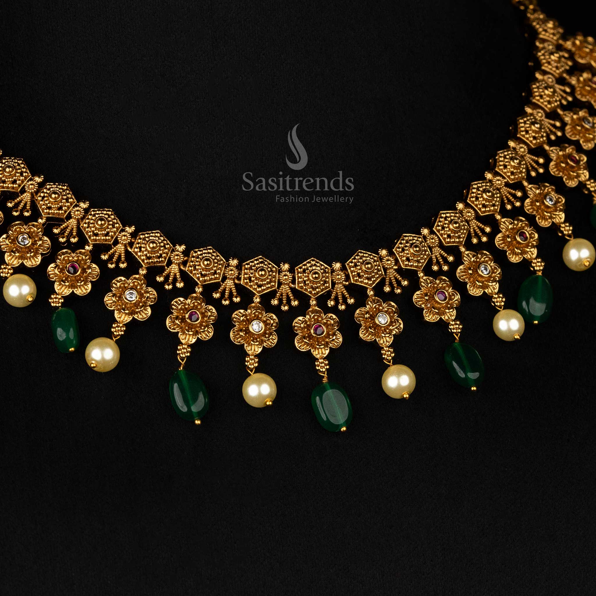 Timeless floral-motif temple jewellery set in matte gold with green bead drops, ideal for traditional and bridal outfits - Sasitrends