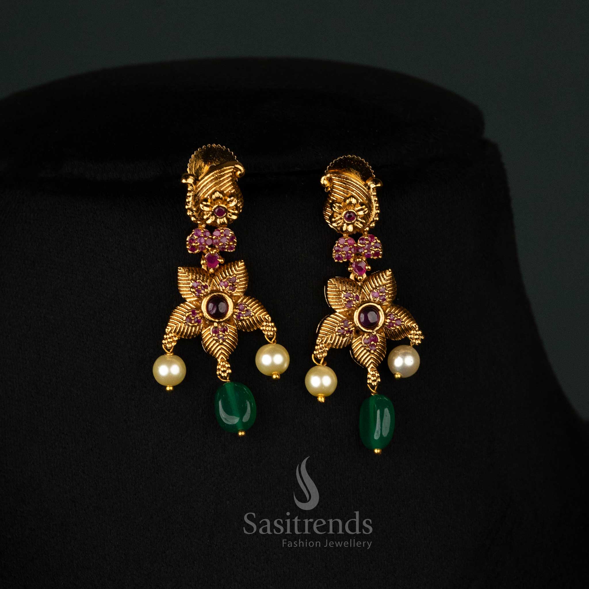 Elegant matte-finish gold earrings set with ruby accents, green beads, mango design, and delicate pearl drops - Sasitrends