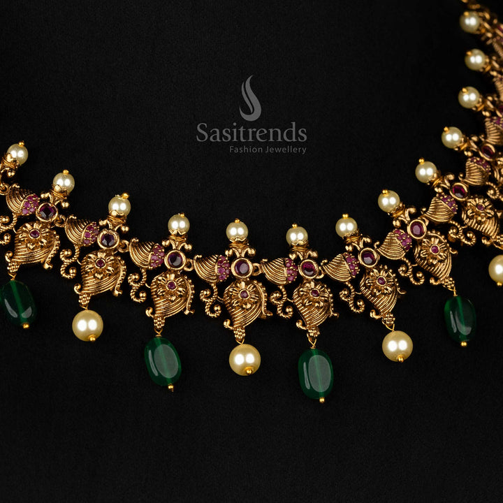 Timeless temple-style necklace set showcasing ruby stones, green beads, mango motifs, and pearl details - Sasitrends