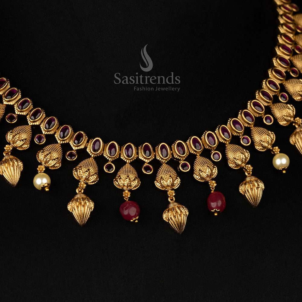 Regal bridal temple jewellery set featuring a matte gold finish, ruby stones, pearls - Sasitrends