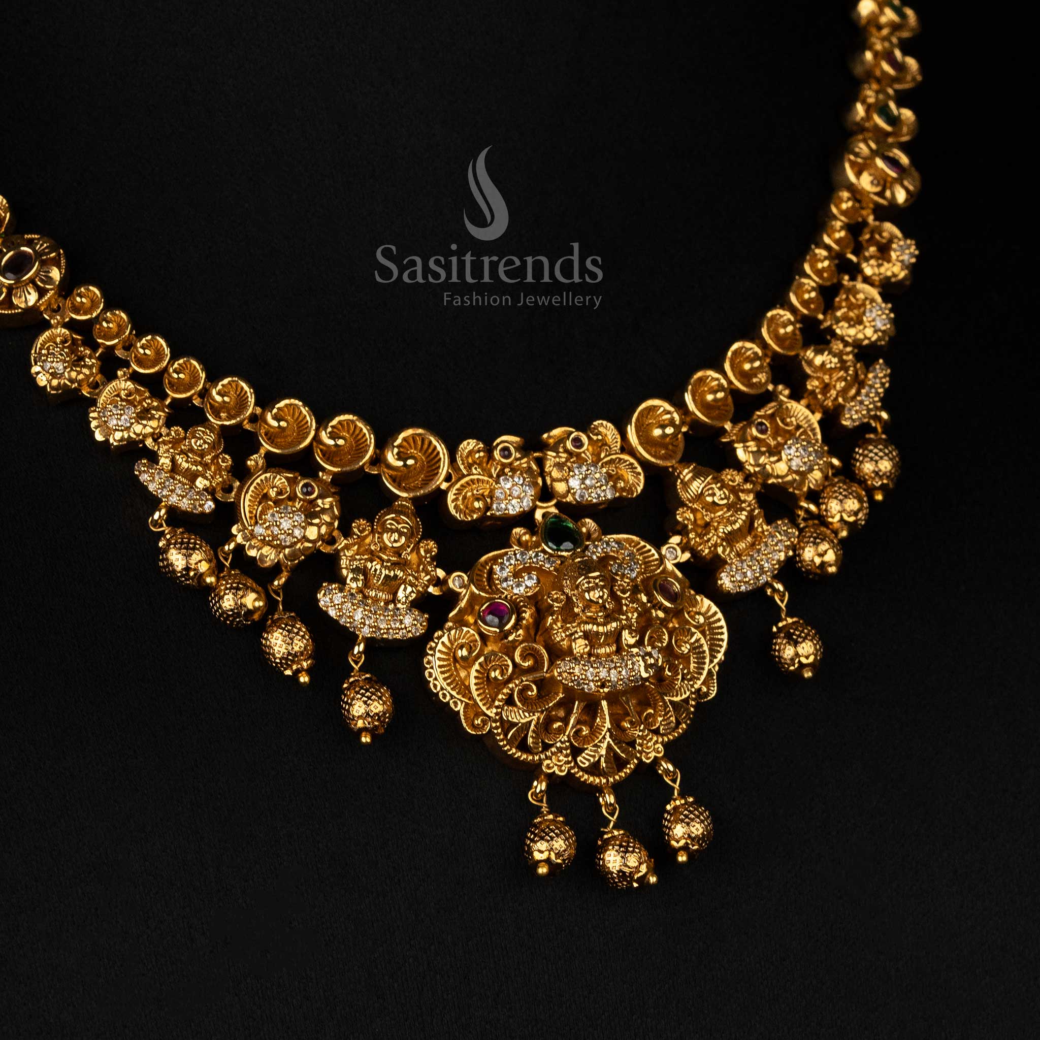 Elegant matte gold-plated temple jewellery necklace featuring Lakshmi and peacock motifs, accented with beautiful beads - Sasitrends