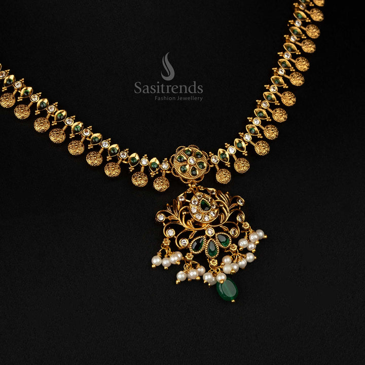 Elegant temple-style matte gold-plated jewellery set with green stones and intricate floral motifs, ideal for bridal wear - Sasitrends