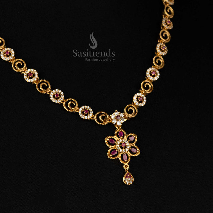 Royal matte gold plated floral swirl necklace set adorned with sparkling white-ruby stones, an exquisite drop pendant, and opulent styling - Sasitrends