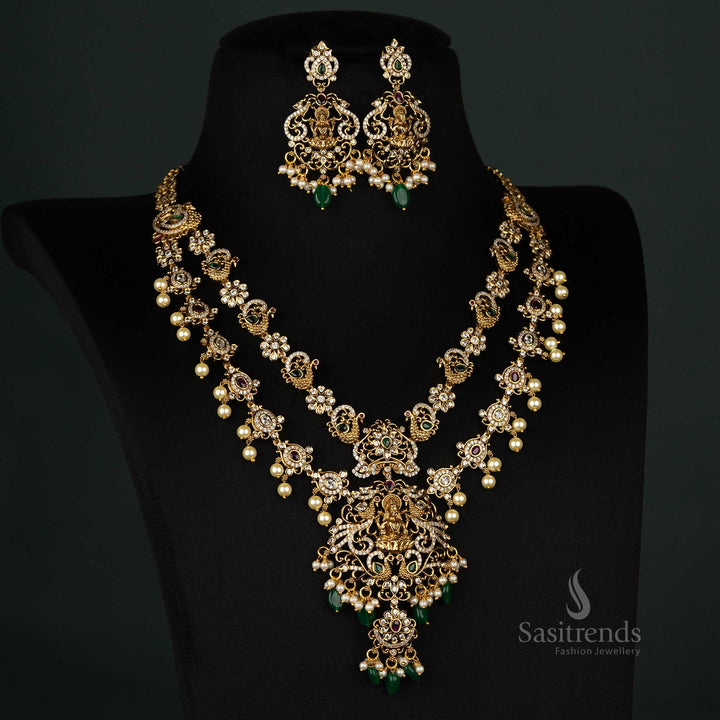 Regal temple-style two-line jewellery set featuring matte gold plating, Lakshmi motifs, peacock designs, and elegant pearls - Sasitrends