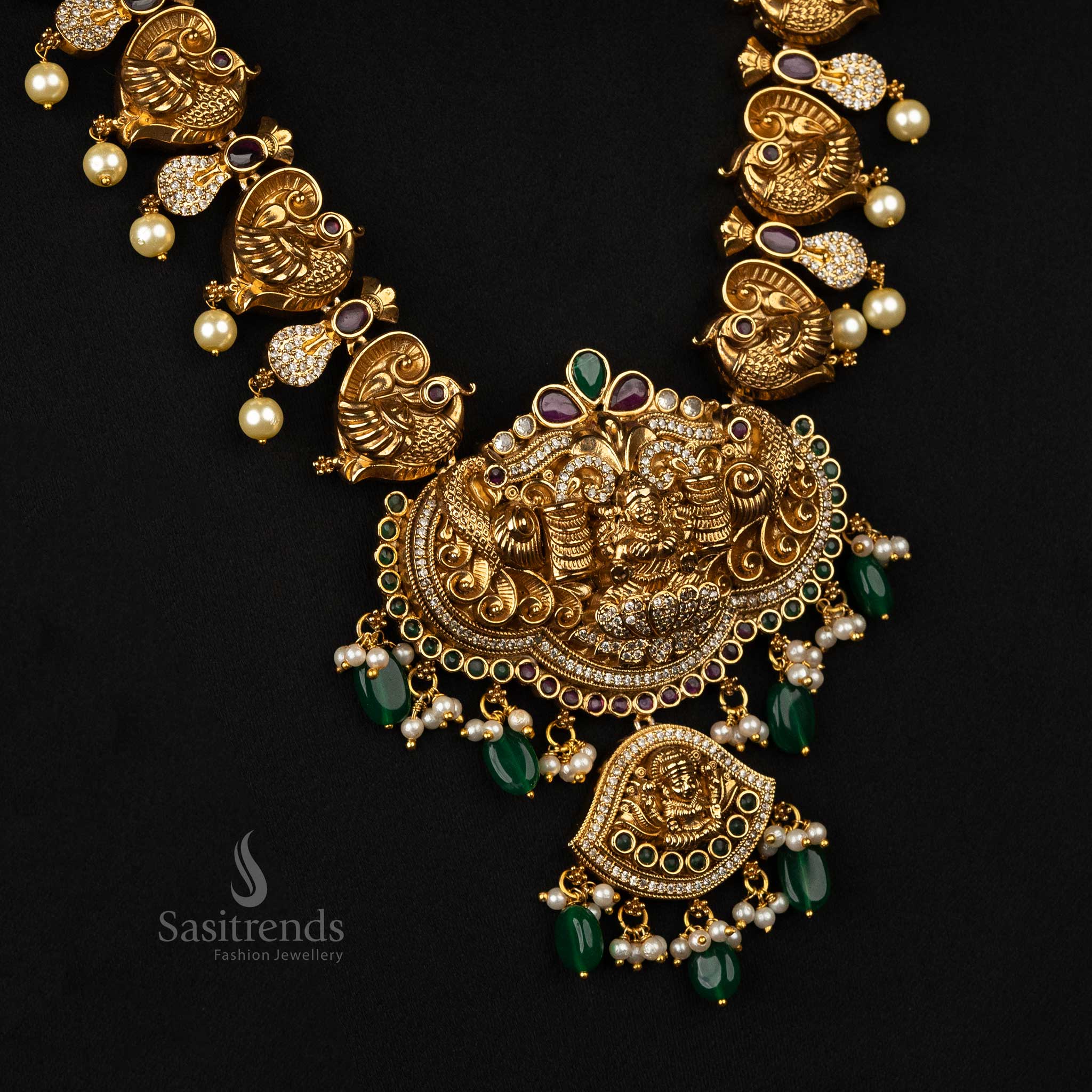 Elegant matte gold jewelry set showcasing peacock motifs, dual pendants - Sasitrends