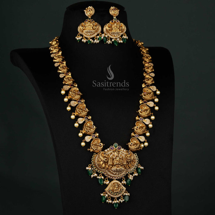 Elegant matte gold jewelry set showcasing peacock motifs, dual pendants, and coordinated jhumka earrings - Sasitrends