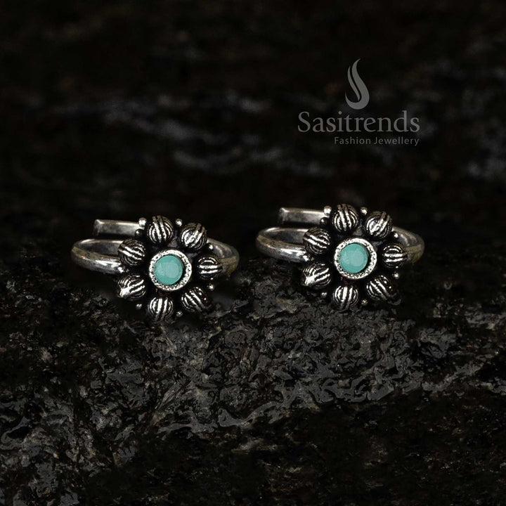 Oxidised adjustable toe ring with a pastel mint green stone surrounded by a delicate petal motif, creating a soothing vintage-inspired look - Sasitrends