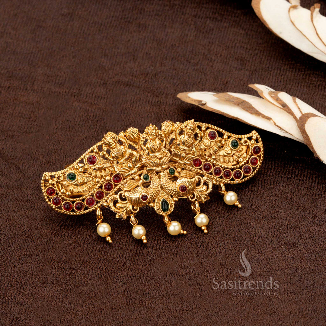 Temple matte gold-plated Lakshmi center hairclip with intricate peacock design and pearl hangings - Sasitrends