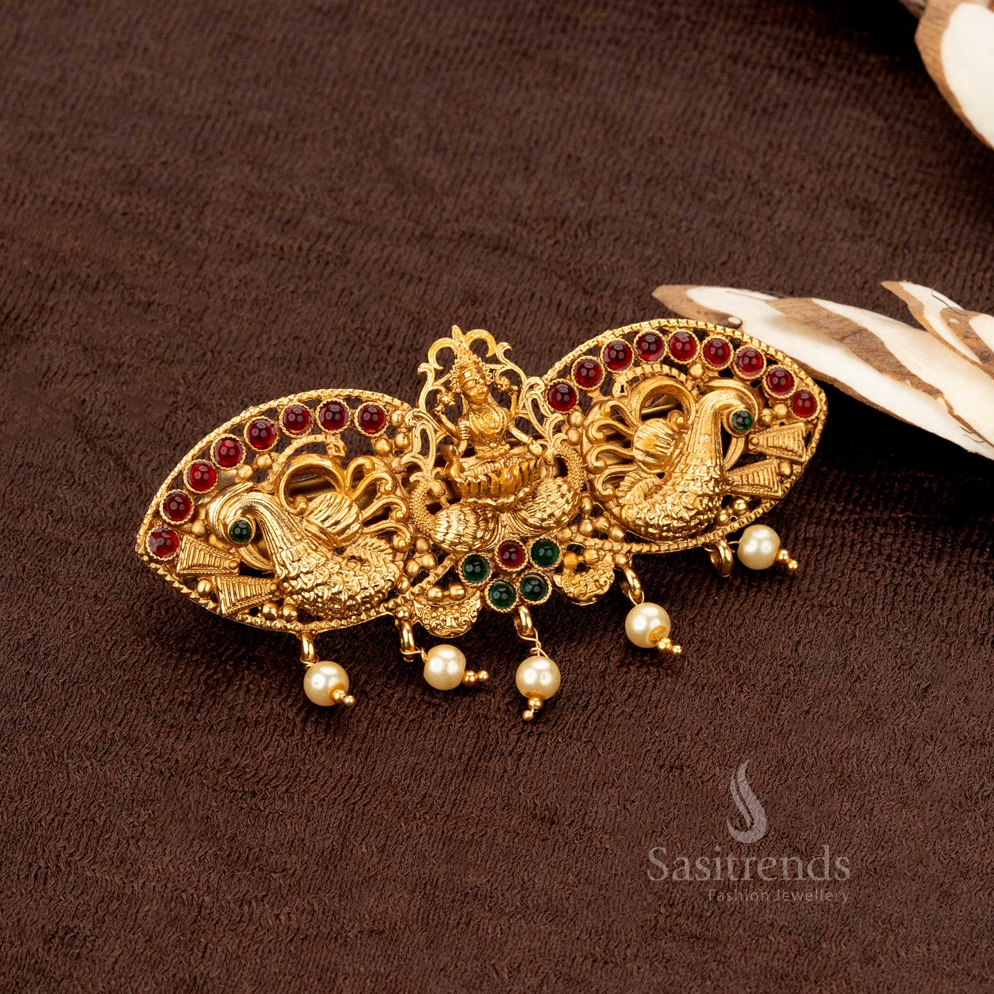 Elegant Lakshmi-themed matte gold-plated hairclip with ruby stone embellishments and pearl drops - Sasitrends