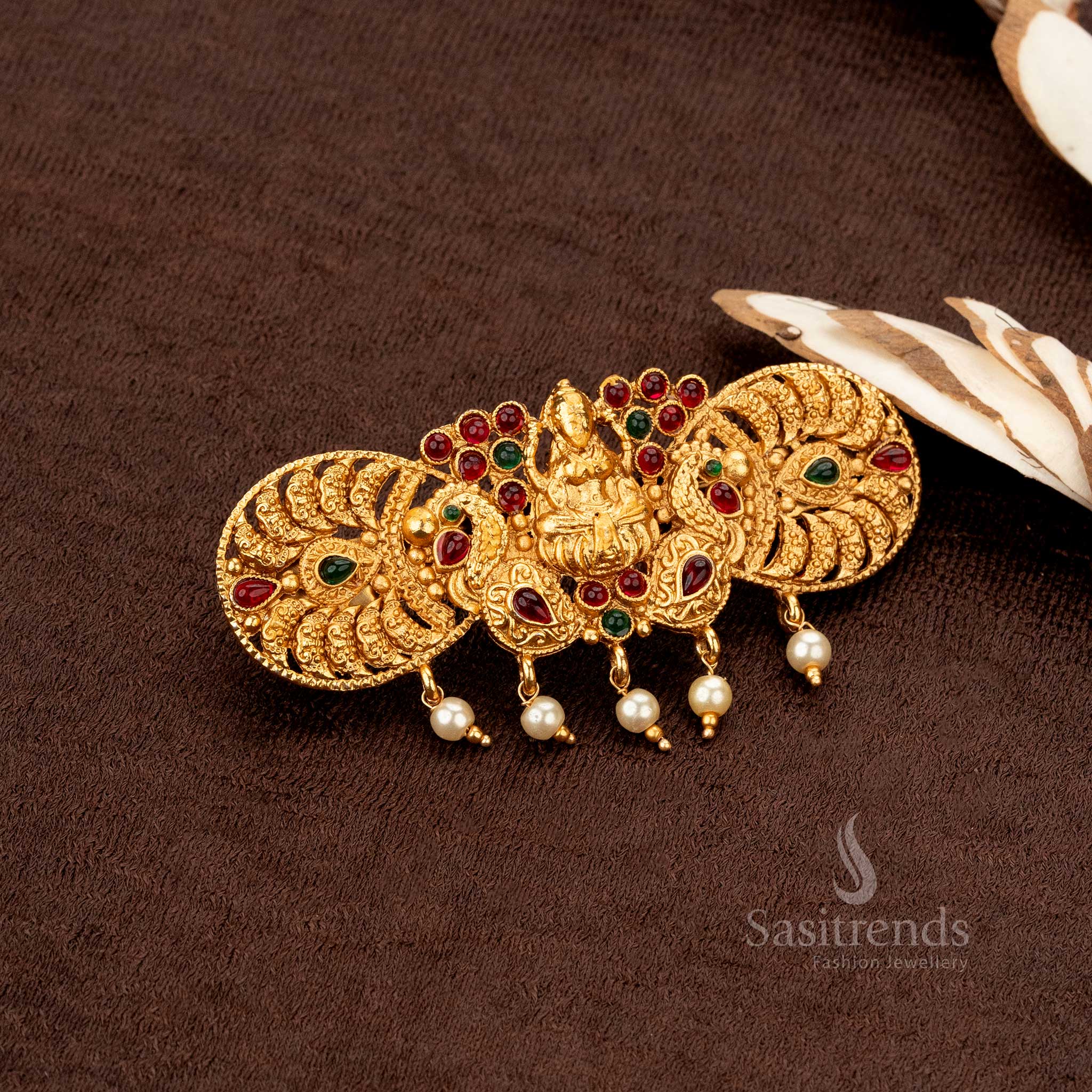 Matte gold-plated temple hairclip with Lakshmi and peacock engraving, perfect for saree styling - Sasitrends