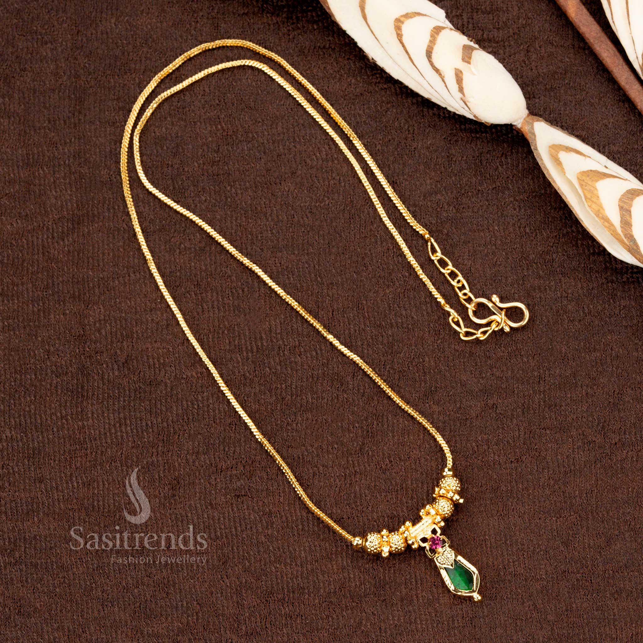 Vintage grandeur Kerala traditional one gram micro gold plated green Palakka necklace, adorned with classic balls and a richly detailed Chaka Palakka Nagapadam pendant - Sasitrends