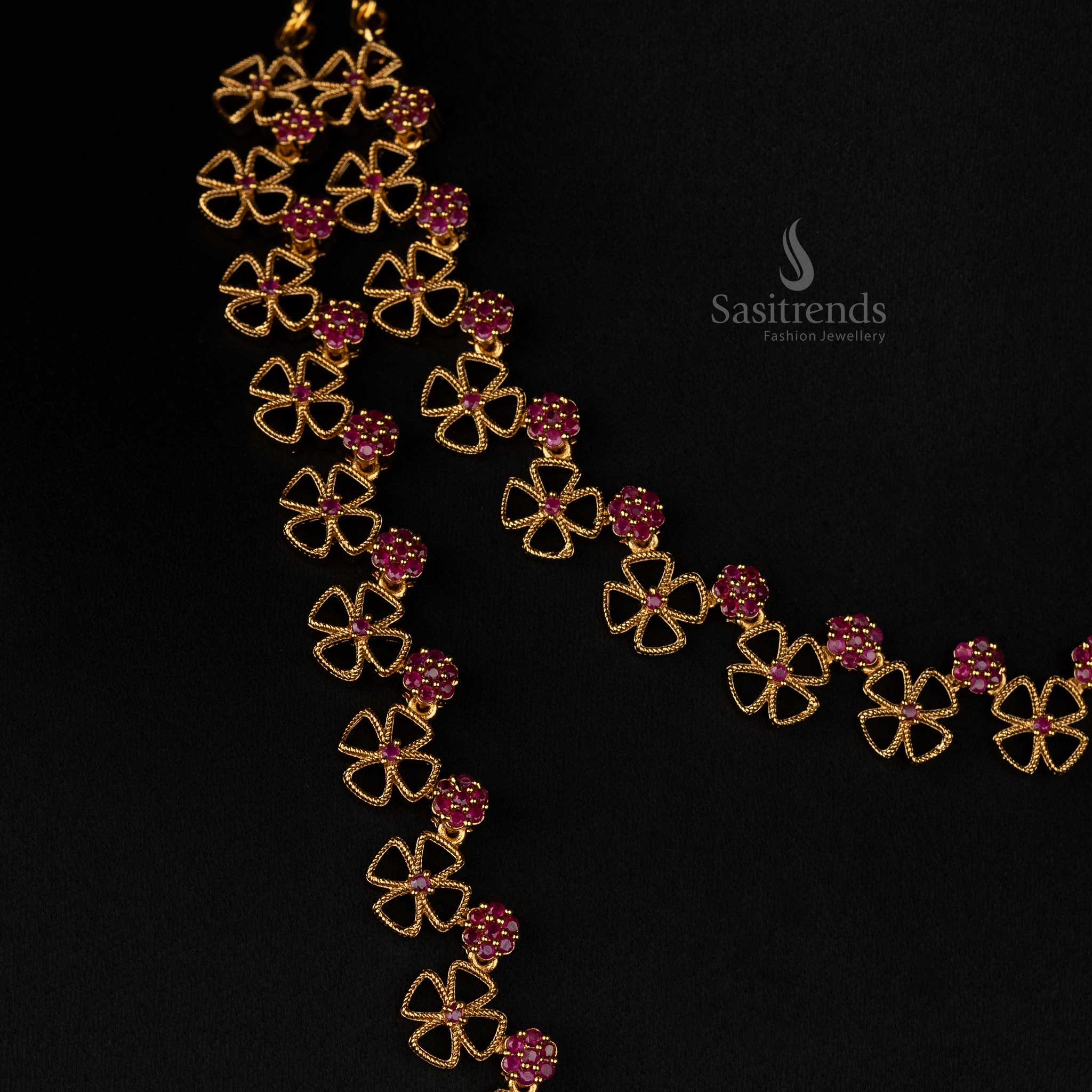 Luxurious floral clover design matte gold plated necklace set with radiant ruby stone accents and artistic craftsmanship - Sasitrends