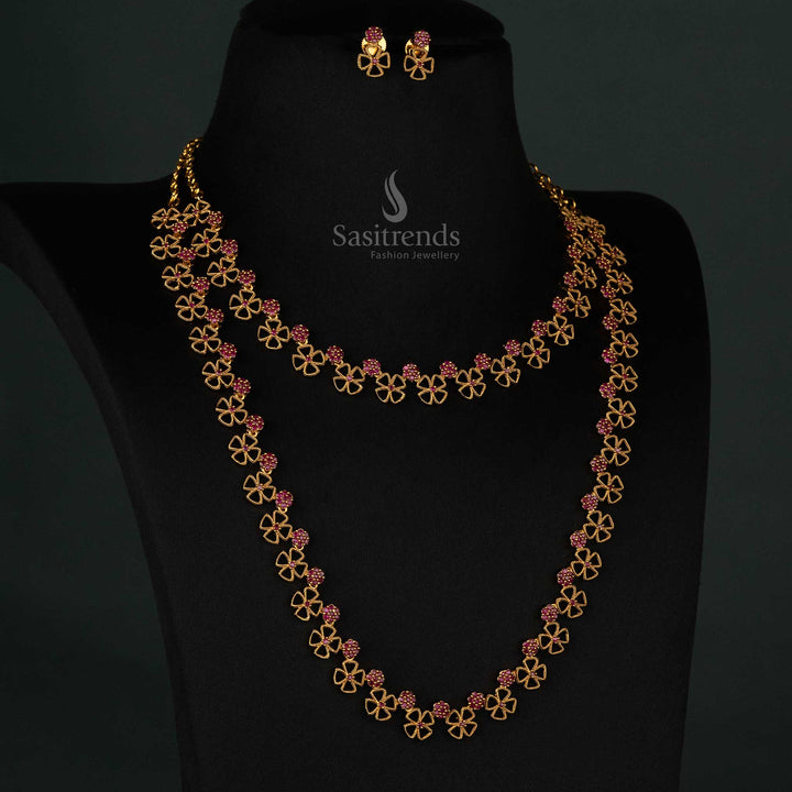 Elegant floral clover design matte gold plated long and short necklace set with intricate ruby AD stone detailing and matching earrings - Sasitrends