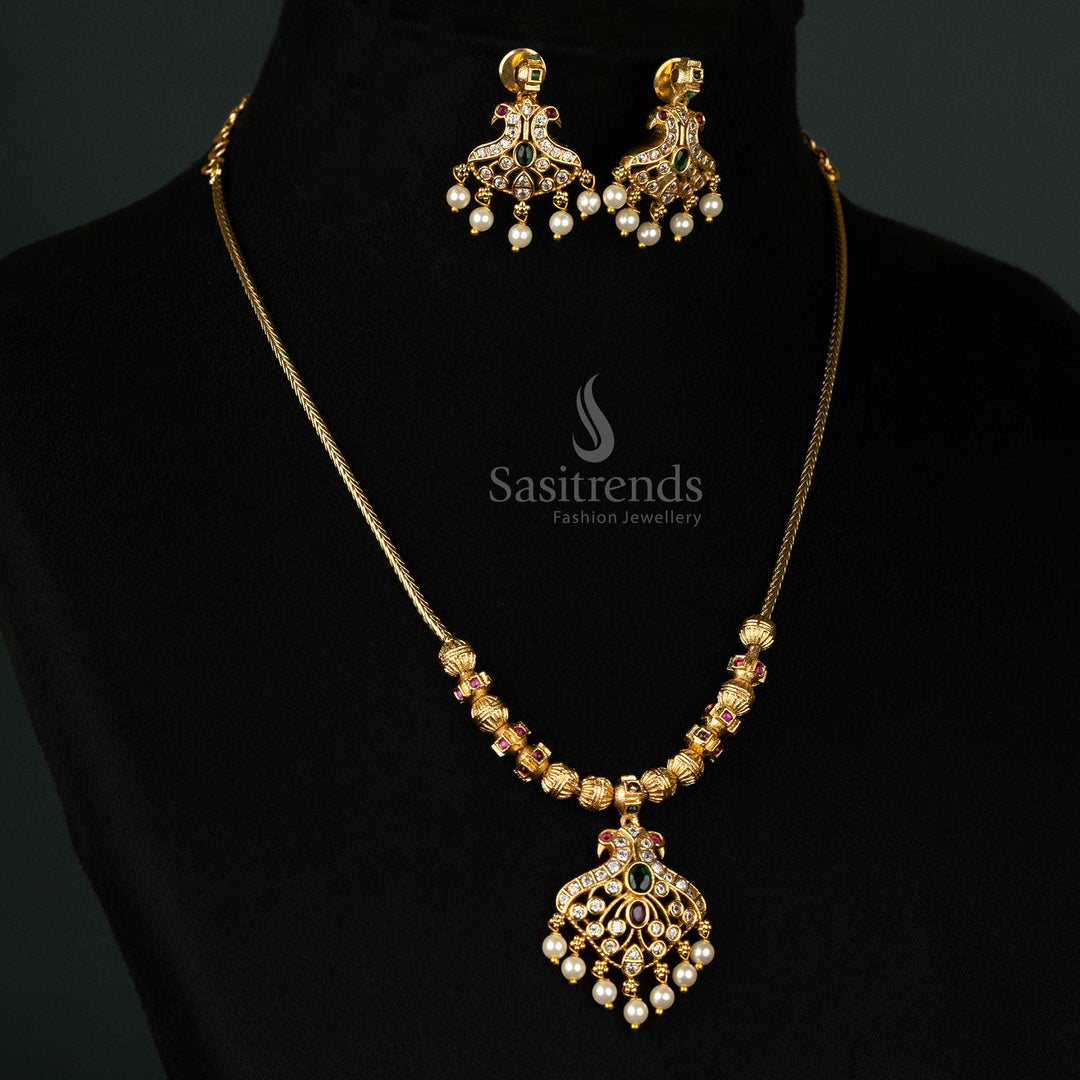 Matte gold plated temple necklace set with intricate peacock pendant, beaded chain, American Diamond stones, and pearls – Sasitrends