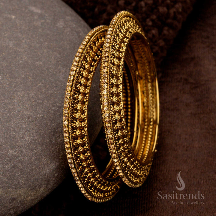 Antique oxidised gold plated bangles with intricate detailing for festive wear - Sasitrends