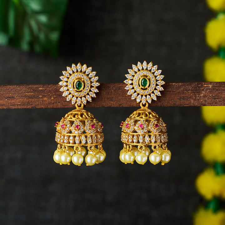 Shimmering AD Stone Jhumkas in Matte Gold: Captivating Beauty and Traditional Charm