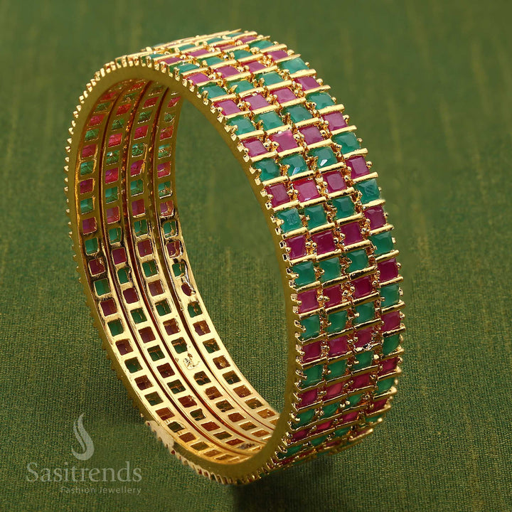 Enchanting Ruby Green Micro Gold-Plated American Diamond Square Bangle, exquisitely designed with a vibrant mix of ruby and green stones - Sasitrends