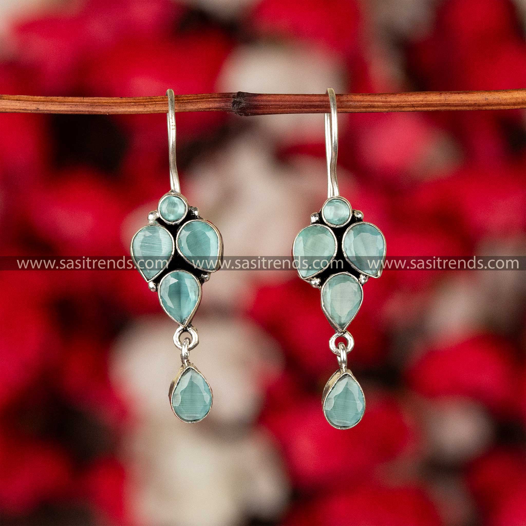 Emerald green gemstone dangle earrings in an oxidized finish